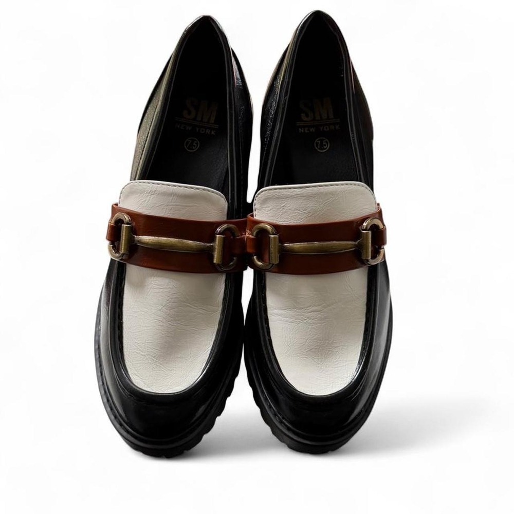 SM New York black and white loafers with gold buckle detail
